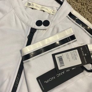 Blanc noir white romper with black detail, size small.